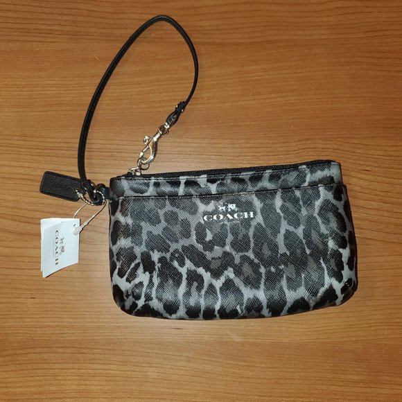 Coach Handbags - NWT Coach Peyton Ocelot Print Wristlet & gift box